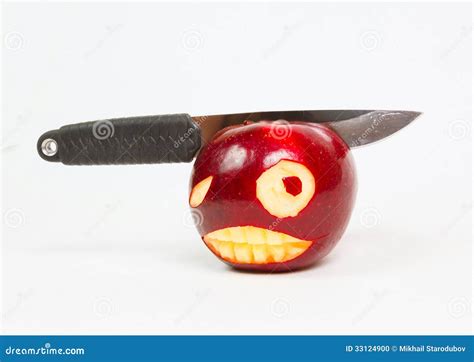 Angry Face Is Carved On An Apple And A Knife Stock Photo Image Of