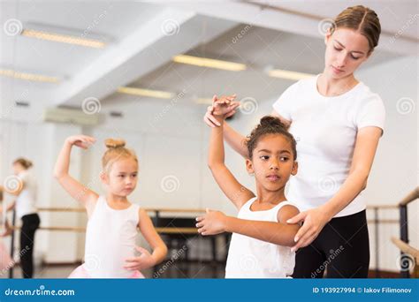 Dance Teacher Helping Her Little Girls Students Stock Photo Image Of