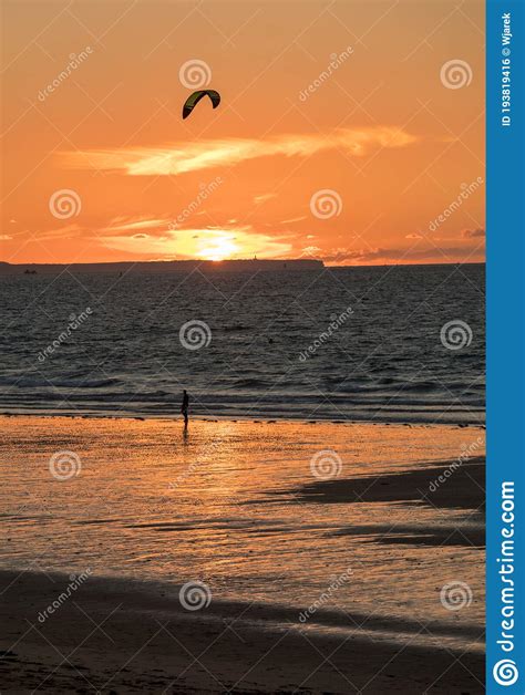 Sunset And Kitesurfers On The Beach In Saint Malo Brittany France