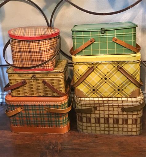 great collection of fall colored plaid and basket weave vintage tin picnic baskets vintage