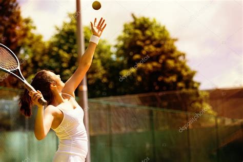 Tennis Player Serving Stock Photo By Wavebreakmedia