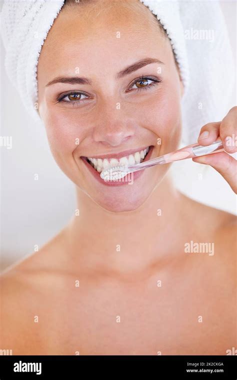 Disciplined Brushing Equals Sparkling Teeth Portrait Of A Stunning Woman Brushing Her Teeth
