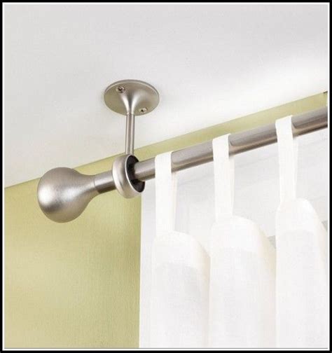Slide your curtains onto the curtain rod and insert the rod into the mounting brackets. Curtain Rods Ceiling Mount Bracketshome Design Ideas ...