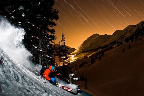 Bryce Phillips Skiing Powder At Night Under Star Trails In The Alta