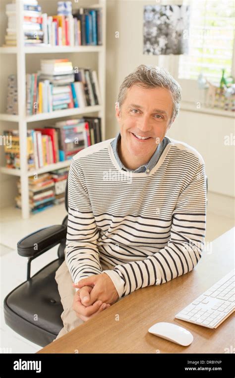 Man Smiling At Computer Desk Stock Photo Alamy