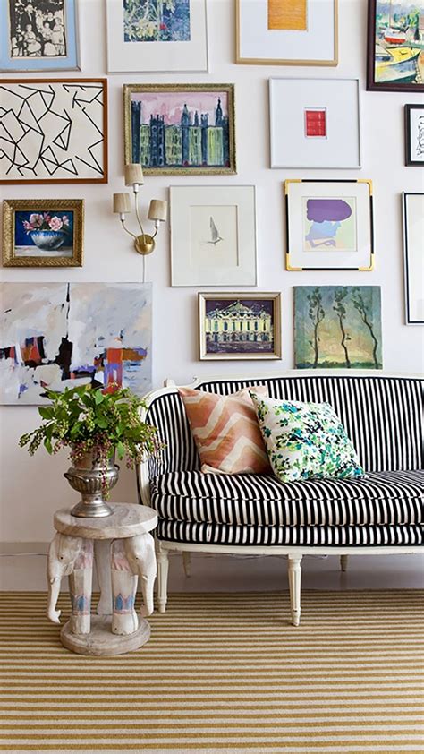 an eclectic gallery wall with a fabulous mix of framed art ~ loversiq art gallery wall