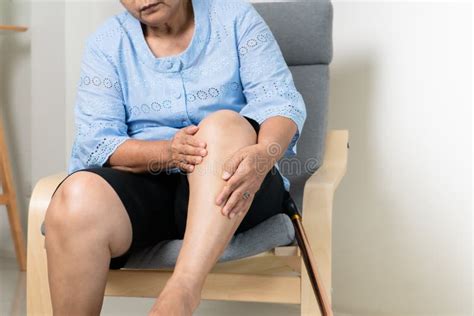 Leg Pain Of Senior Woman At Home Healthcare Problem Of Senior Concept
