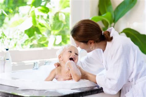 Shopping for baby bathtubs, you may see some brands that look familiar. Mother And Daughter Bathing Stock Photos, Pictures ...