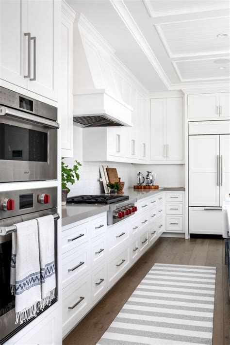 Always beautiful, always marketable, and always valuable, white cabinets continue to set the. Crisp white kitchen paint color Traditional White Kitchen ...