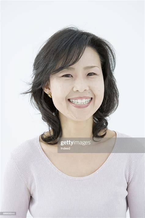 Mature Woman Smiling Portrait High Res Stock Photo Getty Images