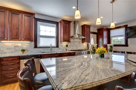 We were very pleased with our cabinets and granite countertop. Viscont White granite countertops with Cherry cabinets ...
