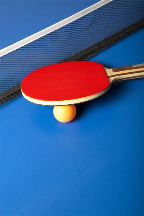 Table Tennis Or Ping Pong Rackets And Balls On A Blue Table Table Tennis Ping Pong Tennis