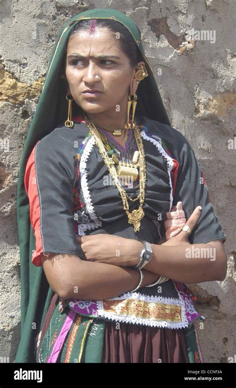 Indian Tribal Women From The Kachchh Region Of Gujarat State Looks On As She Arrives At The Mota