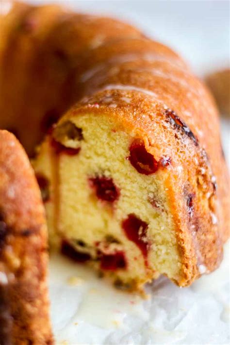 Above all,this cake topped with white cream cheese frosting, red cranberries and drizzled. Cranberry Orange Pound Cake