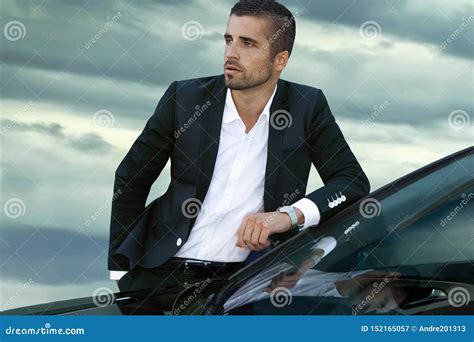 Portrait Of A Handsome Businessman Standing Near The Car Outside Stock