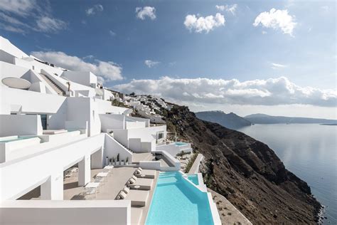 Saint Hotel On The Coast Of Santorini Has Rooms In White Painted Caves
