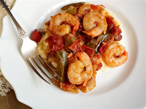This southern louisiana shrimp creole dish is cooked with tomatoes, onions, peppers and celery. Foodista | Recipes, Cooking Tips, and Food News | Creole Shrimp and Grits