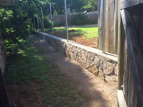 • rail steel material naturally resistant to weathering. Retaining Wall Fence | JCL Landscaping | Dallas, Texas