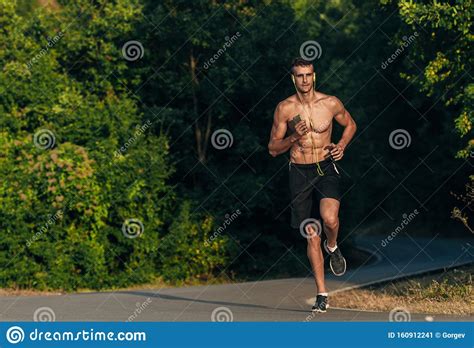 Male Athlete Fitness Runner Sprinting Fast Outsidetrail Running