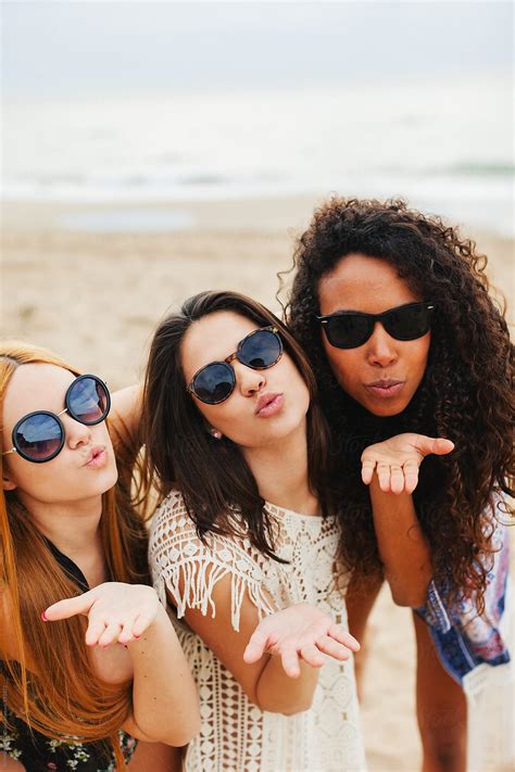 Portrait Of Female Friends Having Fun On The Beach By Stocksy Contributor Bonninstudio