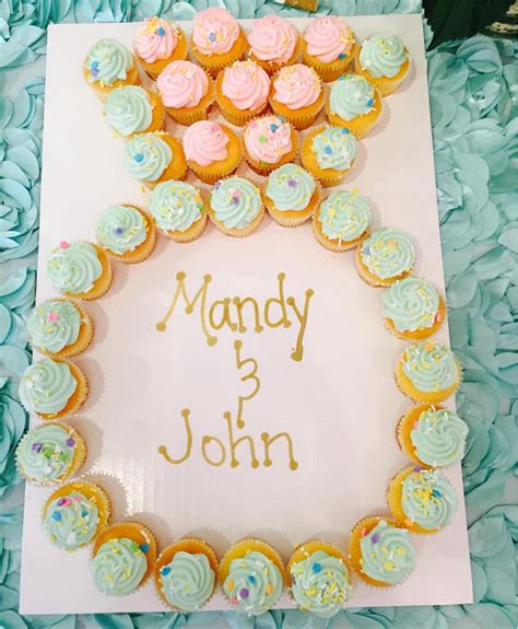 Two tier red velvet cake covered in fondant and decorated with hand cut fondant accents. Diamond Ring Engagement Cupcake Cake - Crafty Morning