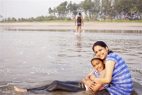 Indian Mother And Daughter Enjoying Vacations At Konkan Beach Resort