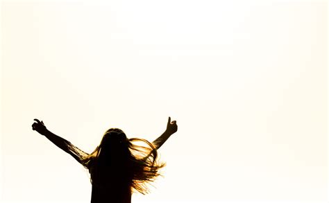 Silhouette Of Woman Raising Her Hands 615334