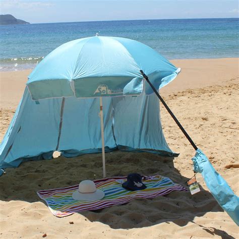 An Umbrella Is Set Up On The Beach