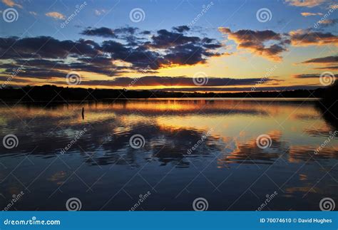 Clouds And Sunset Reflected In Still Water Stock Photo Image Of Water