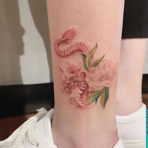 A famous tattoo among the young girls is the floral dragon tattoo tribal style. pin; jasmineadella🖤 in 2020 | Red dragon tattoo, Dragon ...