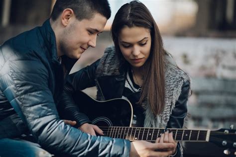 Teenage Couple Playing Guitar ~ People Photos ~ Creative Market