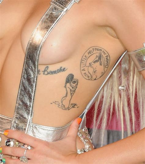 Mileys First Tattoo Ever Was The Phrase Just Breathe On Her Rib