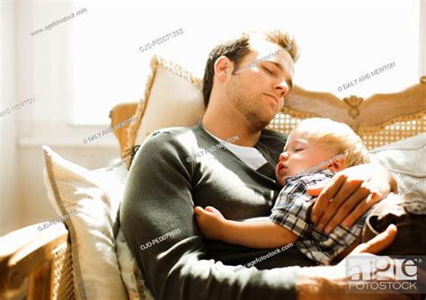 Father Napping With Son On Sofa Stock Photo Picture And Royalty Free Image Pic Ojo Pe