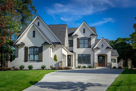 2030 White Brick House With Stone Accent