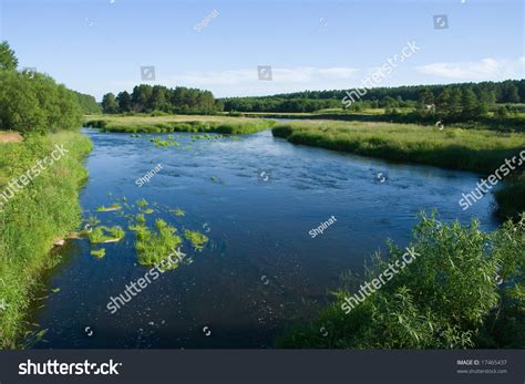 Tranquil River Flowing Through Meadows Before Stock Photo 17465437