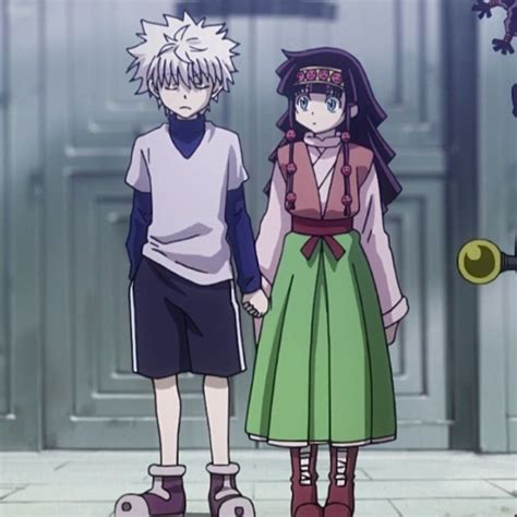 Two Anime Characters Standing Next To Each Other