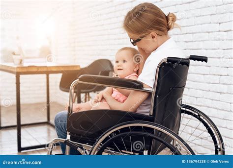Disabled Mother In Wheelchair With Newborn Baby Stock Photo Image Of