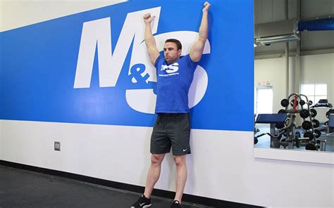 Back To Wall Shoulder Flexion Video Exercise Guide And Tips