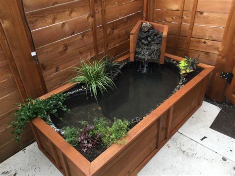 I have dreams of recreating this pond with an ornate clawfoot tub, but in the meantime, we used a standard metal tub. How to turn old bathtub into a natural-looking pond