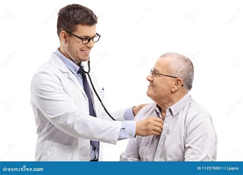 Doctor Examining An Elderly Patient With A Stethoscope Stock Image