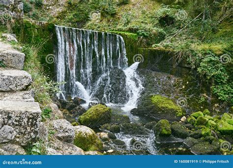 Waterfall At Source Du Doubs Mouthe Franche Comté France With Green