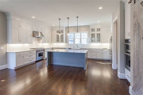 Kempsville cabinets has been manufacturing custom cabinets since 1979. Custom inlay white cabinets and contrast gray island in ...