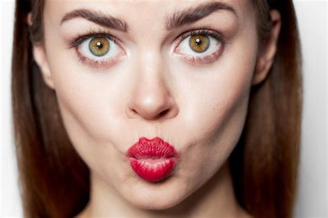 Premium Photo Closeup Portrait Of Woman Blowing Kiss Red Lips