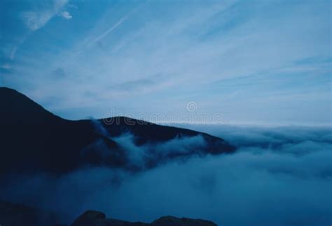 Clouds At Dawn With Low Hanging Fog Over The Blue Ridge Mountains Stock
