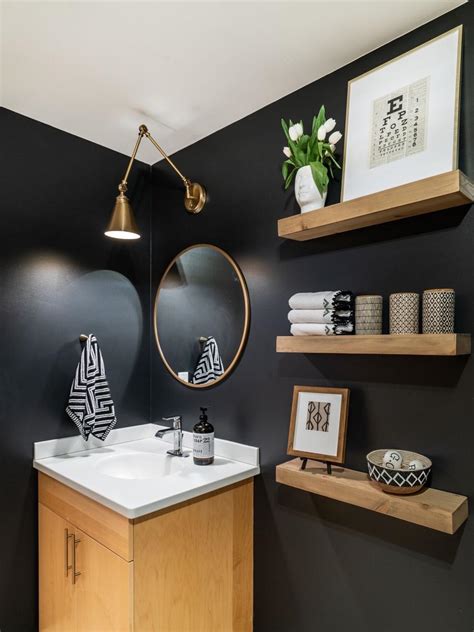 With the right bathroom shelves in the right place(s), your bathroom becomes an oasis. Contemporary Black Guest Bathroom With Floating Shelves | HGTV
