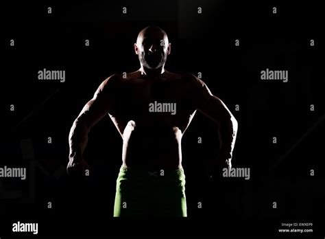 Siluet Muscular Man Flexing Muscles Stock Photo Alamy