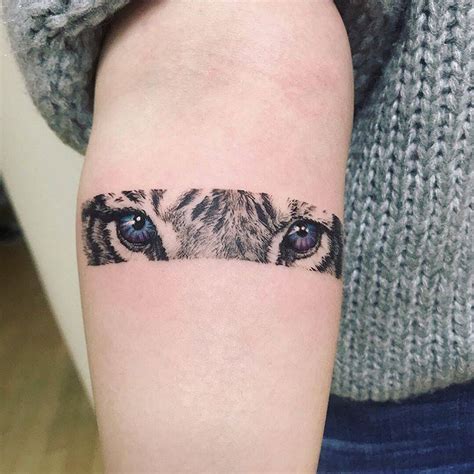 Tiger Eyes Tattoo On The Inner Forearm