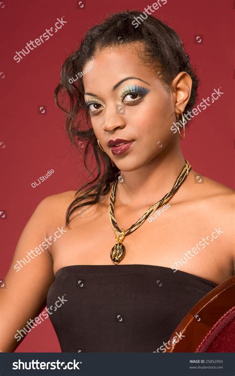 Glamour Young Dark Skinned Biracial Mulatto Female With Dramatic Makeup Wearing Jewelry Necklace