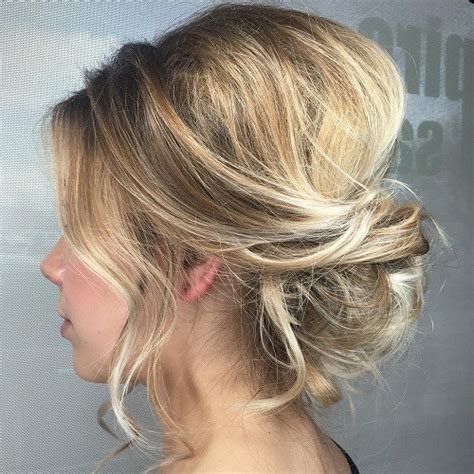 Add a twist to your usual messy bun by adding some braids to make your hair look extra. 60 Easy Updo Hairstyles for Medium Length Hair in 2021