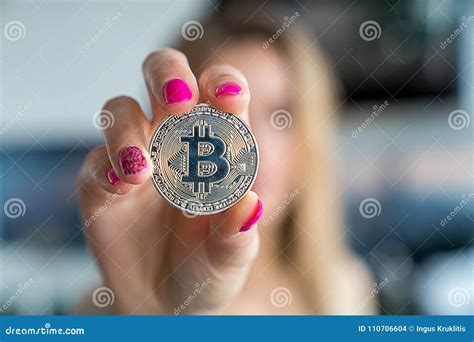 Young Girl Holding A Bitcoin Coin In Her Hand Stock Photo Image Of
